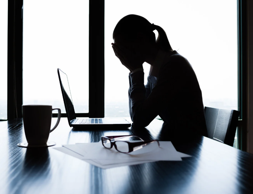 woman stressed by poor office climate
